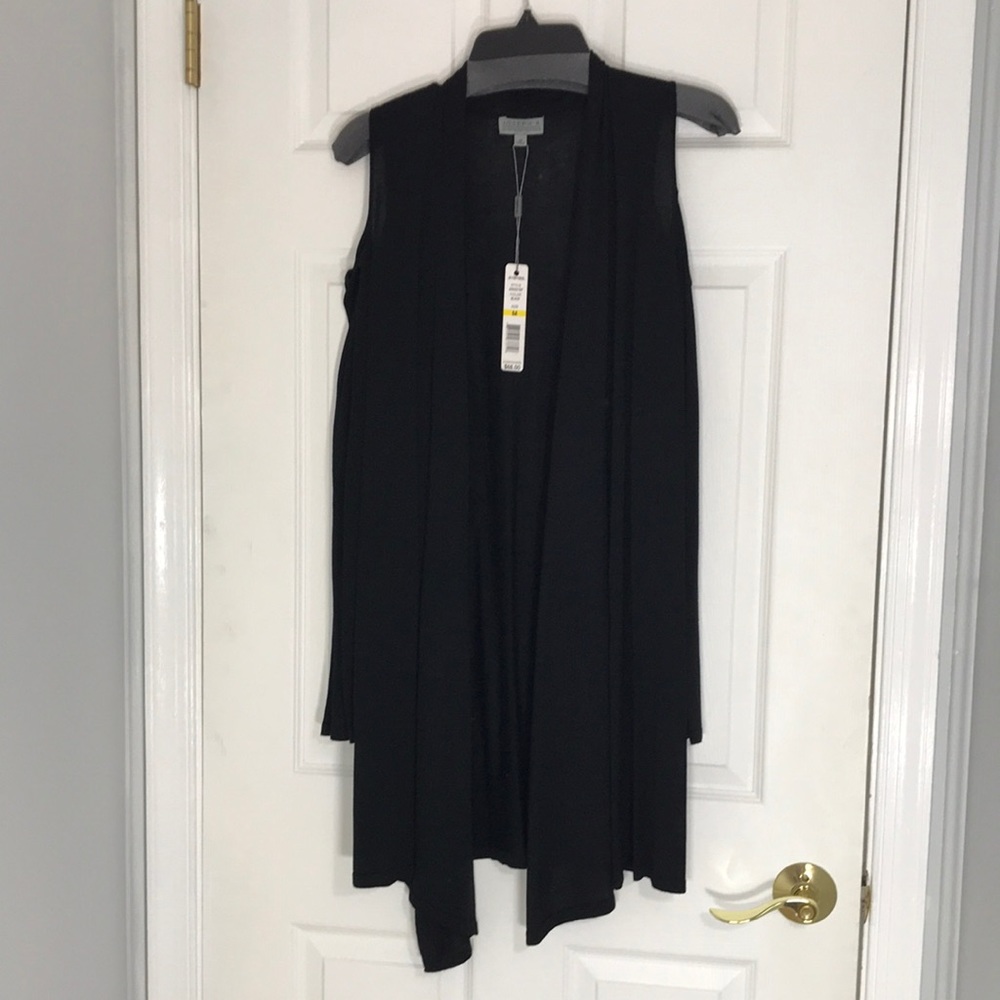 Joseph A black long sleeve, open shoulder sweater.